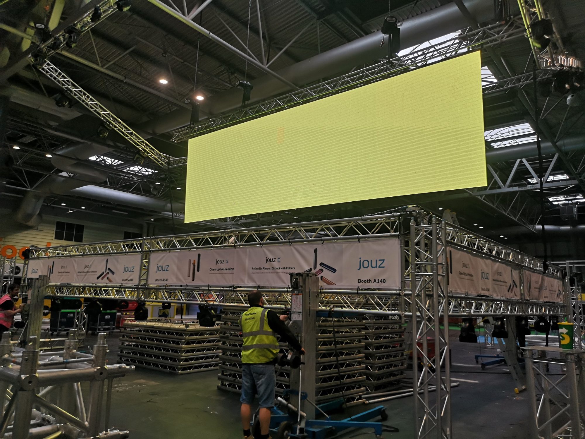 Flown screen in truss