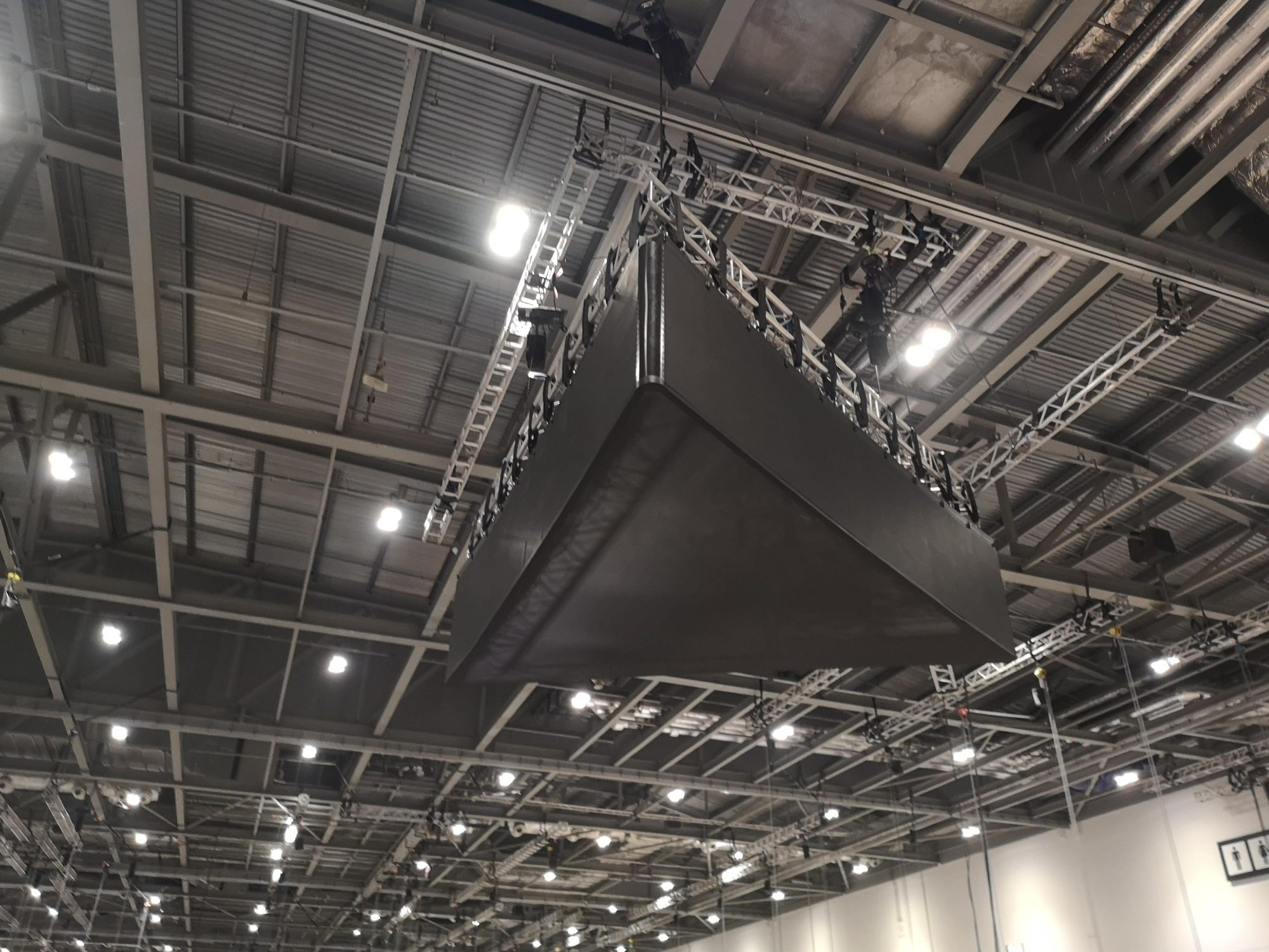 Flown triangle LED being rigged, ExCeL